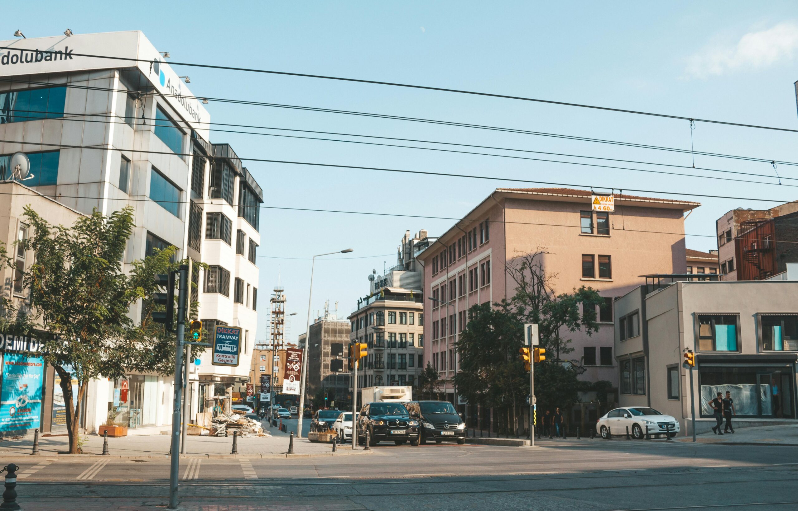 Photo by Emre Can Acer: https://www.pexels.com/photo/vehicles-travelling-on-road-near-buildings-2079292/