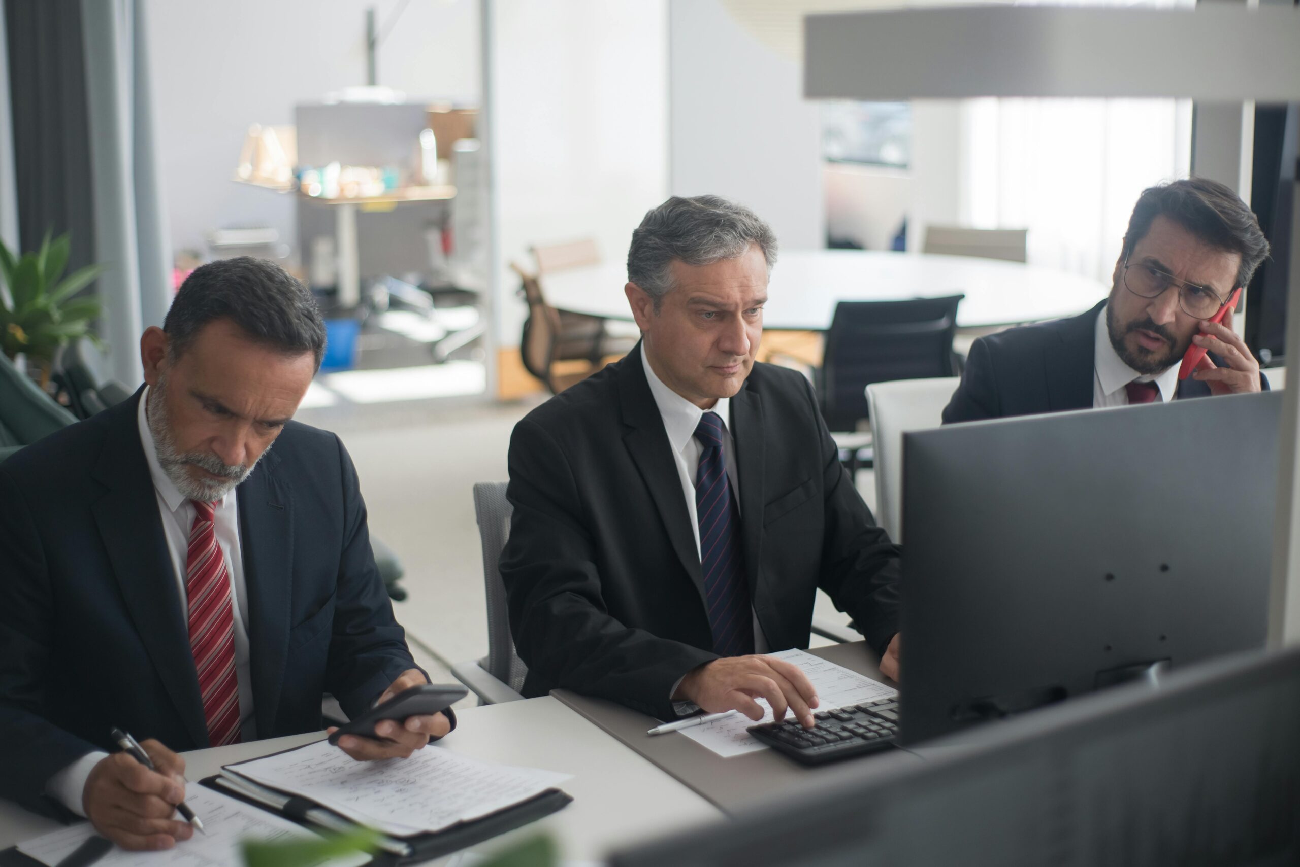 Photo by Kampus Production: https://www.pexels.com/photo/men-in-corporate-attire-working-in-an-office-8353786/